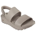صندل سكيتشرز النسائي ارش فيت فوتستيبس دي دريم بلاتفورم بني رمادي مقاس 41 يتميز بتصميم علوي من فوميز ونعل داخلي مريح بتقنية ارش فيت وحزام كاحل قابل للتعديل لراحة تدوم طوال اليوم - سكيتشرز