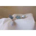 Unique drop earrings combining the Hamsa hand charm, embellished with turquoise zircon, with a marbled oval bead handcrafted from polymer clay. A stylish piece that reflects cultural beauty and symbolic protection - Lumique