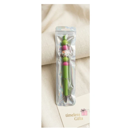 pink beaded pen decorated with bead detailing, featuring an elegant handmade design perfect for gifting and daily use