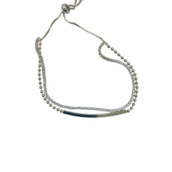 AURA Delicate gold zircon bracelet with a double-rope design – one lined with crystals, the other uniquely textured. A stylish, free-size piece for refined elegance