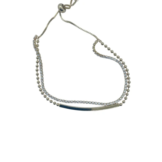 AURA Delicate gold zircon bracelet with a double-rope design – one lined with crystals, the other uniquely textured. A stylish, free-size piece for refined elegance AURA Delicate gold zircon bracelet with a double-rope design – one lined with crystals, the other uniquely textured. A stylish, free-size piece for refined elegance
