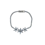 AURA Gold zircon bracelet adorned with crystals and featuring three elegant roses at the center – a charming feminine touch. - Aura